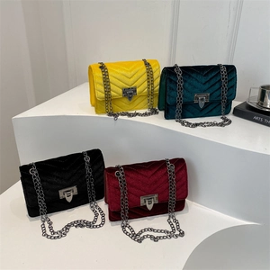 Chic velvet crossbody bags with V-stitch quilting and metal chains in four rich colors