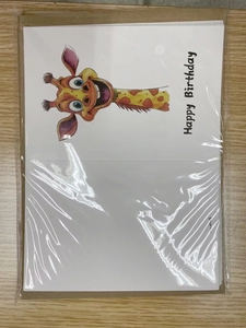 Detail of a white watercolor birthday card with a cartoon giraffe and Happy Birthday text