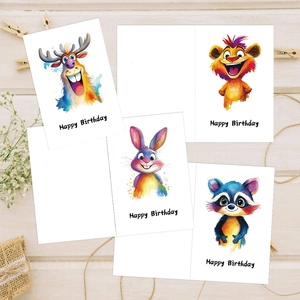 Detailed view of watercolor animal birthday cards on rustic wood with dry flower accents