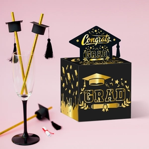 Black and gold Congrats GRAD money box with graduation cap for party atmosphere