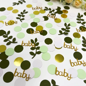 Coriandoli per feste verde salvia con scritta baby dorata e foglie decorative