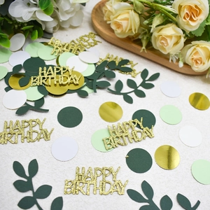 Colorful Happy Birthday confetti with green leaves and gold glitter letters for party decor
