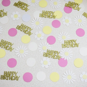 Mix of colorful round confetti with white daisies and gold Happy Birthday lettering