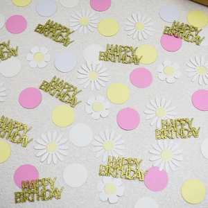 Golden Happy Birthday confetti with macaron circles and daisy flowers for party decor