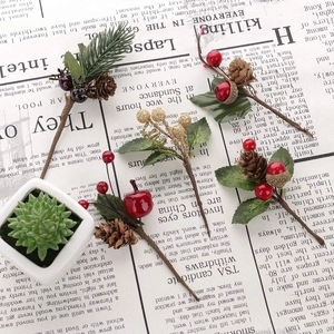 Christmas decoration stems with pine cones, red berries and needles for gift box decor