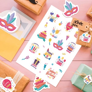 Colorful cartoon birthday party stickers with cake and balloons on pink wood background