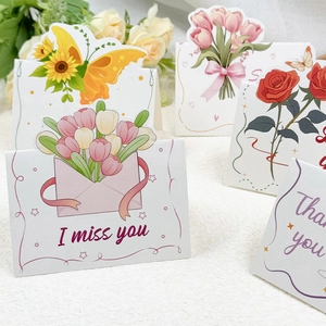 Detail of floral greeting cards with I Miss You and Thank You text on 3D flower designs