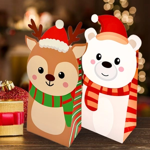 Close-up of Christmas themed paper gift bags with reindeer and polar bear designs