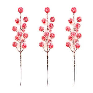 Close-up of artificial red berries with realistic snow texture for festive Christmas decor