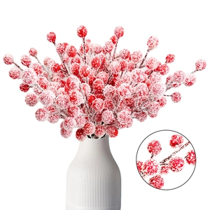 Red Christmas berry branches with snow frost in a white ceramic vase, main product view