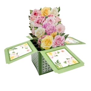 Detailed view of 3D pop-up floral greeting card with colorful roses and green base