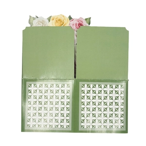 Detail of 3D pop-up greeting card featuring paper roses and white geometric cutouts