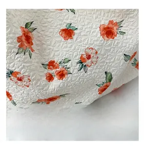 Close-up of seersucker tote bag fabric with rose patterns and textured surface