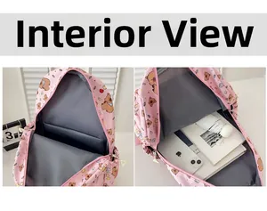 Detail view of pink cartoon bear backpack showing internal compartments and storage capacity