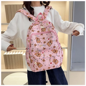 Close-up of pink school backpack with cute bear print and large capacity pockets