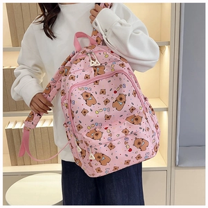 Pink cartoon bear backpack shown in use featuring a large main compartment and side pockets