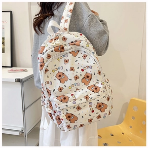 Detail of cute white bear pattern backpack with CUTE print for student school use