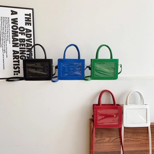 Mini multi-color leather handbags with transparent PVC windows in a step display