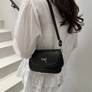 Minimalist black PU leather crossbody square bag with a golden bow metal buckle