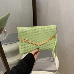 Neon green envelope clutch with wave texture and gold V-shaped metal trim detail