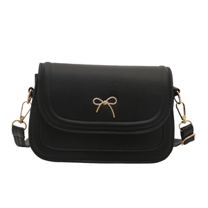 Minimalist black square shoulder bag with gold bow clasp and detachable chain strap