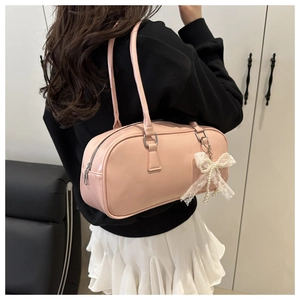 Pink Boston bag detail featuring lace bow, pearl pendant and smooth PU leather texture