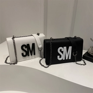Minimalist crossbody square bag with bold SM logo and metal chain strap in black and white