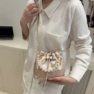 Pink satin bucket bag with gold floral embroidery and pearl handle for women