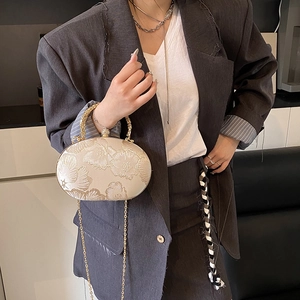Elegant ivory embroidered floral chain handbag with pearl clasp and ring handle