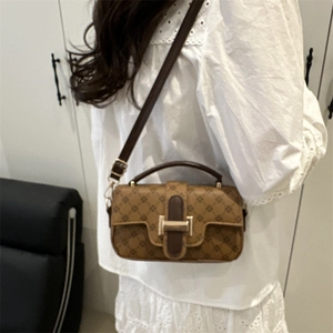 Vintage brown monogram handbag with gold H-buckle and adjustable shoulder strap