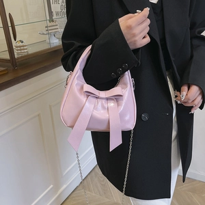 Pink crescent underarm bag with large bow and silver chain strap for women