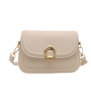 Minimalist beige crossbody bag with matte finish and elegant golden arch buckle