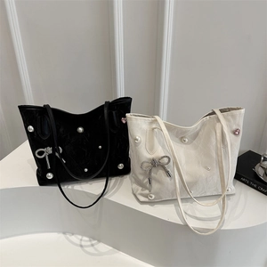 Minimalist tote bag with pearls and rhinestone bow in black and cream white colors