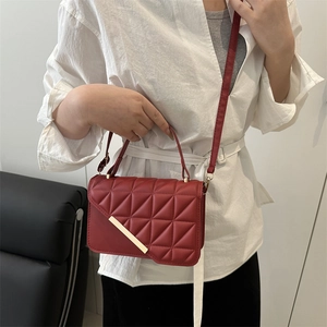 Chic red quilted crossbody bag with gold metal trim and adjustable strap for women