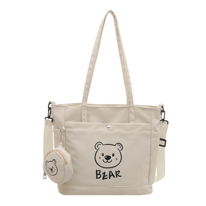 Beige tote bag with cartoon bear print and small matching coin purse on white background