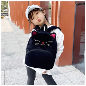Detail of cute plush black cat backpack with pink glitter ears and embroidered face for kids