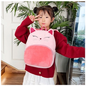 Detail of pink plush cat backpack for kids with sequined ears and front zipper pocket