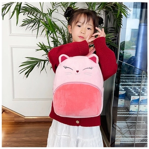 Detail view of pink plush cat backpack with 3D ears on an Asian child model