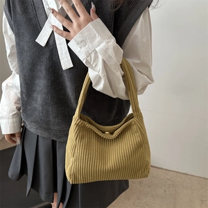 Women's mustard yellow corduroy tote bag featuring a minimalist large capacity design