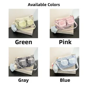 Detail view of four checkered tote bags in green, pink, gray, blue with star plush charms