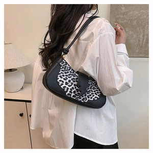 Detailed side view of stylish leopard print shoulder bag featuring a lightning patch