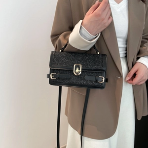 Elegant black sequin crossbody handbag with gold twist lock and leather handle for women