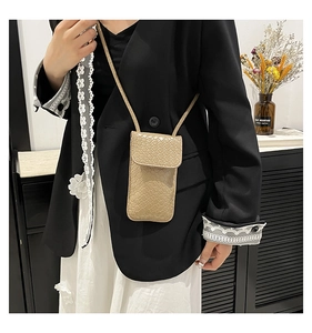 Close-up of khaki woven pattern on a compact vertical crossbody phone bag for women