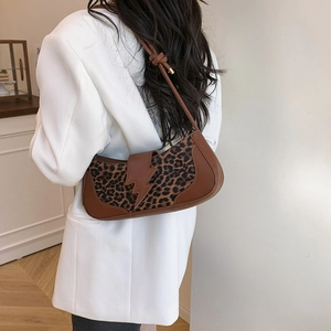 Fashionable leopard print shoulder bag with lightning buckle and knot strap detail