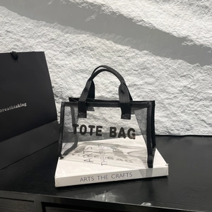Modern black mesh and clear PVC tote bag with stylish TOTE BAG lettering detail
