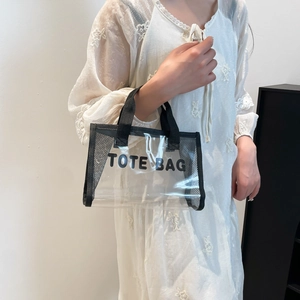 Minimalist transparent PVC tote bag with black mesh panels and Tote Bag lettering print