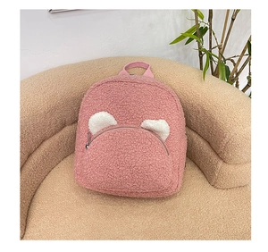 Detailed view of pink plush teddy fleece mini backpack with cute white bear ears