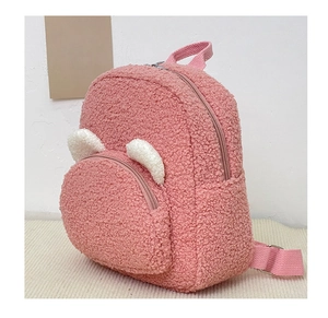 Side view of pink Sherpa backpack with cute 3D bear ears and adjustable straps