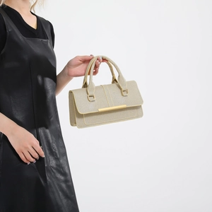 Minimalist beige woven textured handbag with gold metal bar handle for women