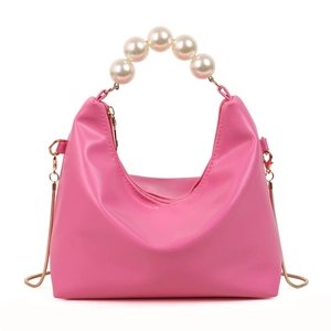 Chic pink pillow handbag with white pearl handle and golden snake chain strap for women